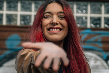 portrait smiling redhead girl with hand