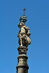 Fototapeta na wymiar Little figure on the fountain column of the Largo do Paço in Braga, Norte - Portugal