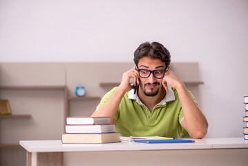 Young male student studying at home