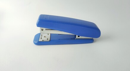 stapler and staples on white