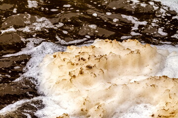 Foam on the river after a waterfall close - up . Russia. Ural.