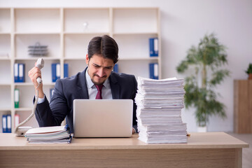 Young male employee working in the office