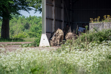 army soldiers on a military exercise in summer sunshine 