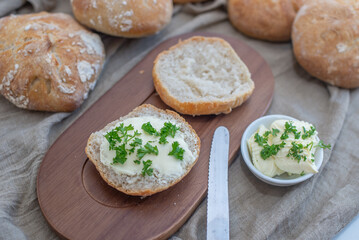 Bread basket, round bread rolls on dark table
