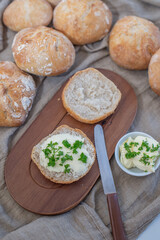 Bread basket, round bread rolls on dark table