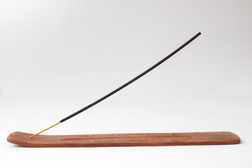 Incense stick on a wooden stand