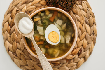 green borsch with egg and sour cream