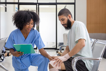 African nurse is examining tendinitis on knee injury from sport accident in Middle East patient for treatment and rehabilitation process - Powered by Adobe