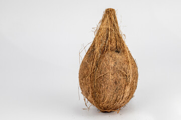 Dried coconut with extreme details of its body texture and hair, isolated in black background and in white background, studio lighting, standing tall and lying down, different angles and composition. 