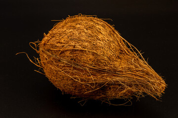 Dried coconut with extreme details of its body texture and hair, isolated in black background and in white background, studio lighting, standing tall and lying down, different angles and composition. 