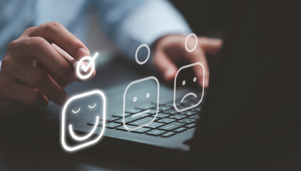 Businessman tick mark to select smiley face icon for client evaluation and customer satisfaction...