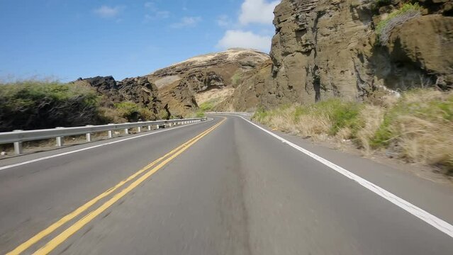 POV Driving A Car On Curvy Asphalt Curvy Road Among The Rocks By The Ocean In Hawaii, Oahu Island