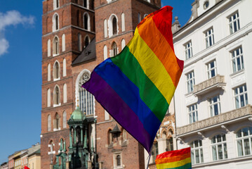 Rainbow flag, symbol of LGBT. Pride Parade equality march in Krakow, Poland to support and...