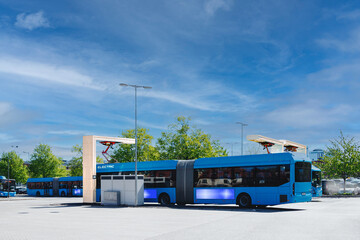 City station for recharging electric public transport. Several urban shuttle buses are connected to...