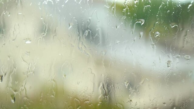 4k frame of raindrops on the window pane.