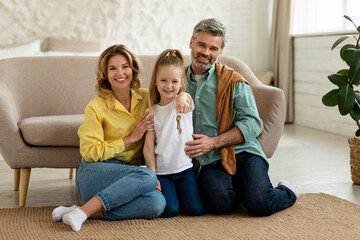 Happy Family Showing New House Key Smiling Sitting At Home