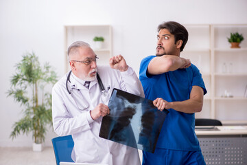 Two male doctors working in the clinic