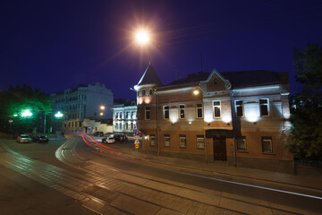 Moscow, Russia - July, 27 2014: Historical buildings in Moscow center at night. Mansion on Yauza boulevard. Tram rails and light traces on foreground.