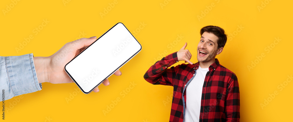 Poster Man showing blank empty smartphone screen and call me sign