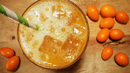 Fresh orange juice or lemonade with kumquats.