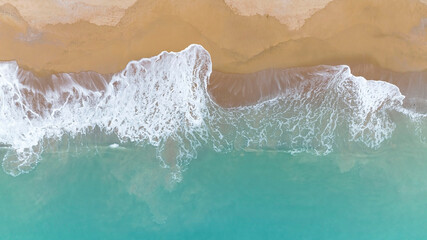 Fototapeta na wymiar Coast as a background from aerial top view. Beach as wave Turquoise water background in Summer seascape