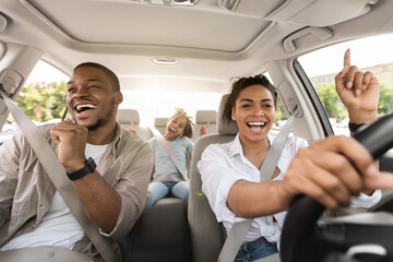 Black Family Singing Riding Car Having Fun Enjoying Road Trip - obrazy, fototapety, plakaty