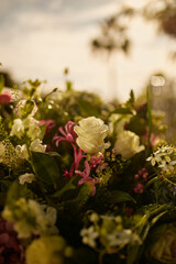 A bouquet of gorgeous festive flowers on a table in the yard. 