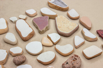 Marine ceramics, fragments of tiles washed and turned with water. Fragments are small, different colors.