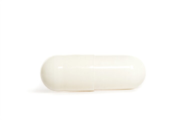 White capsule pill on white background
