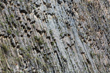 Basalt columns Symphony of Stones near the shore of the river Azat near the village Garni, Armenia.Tourism landmark in Armenia