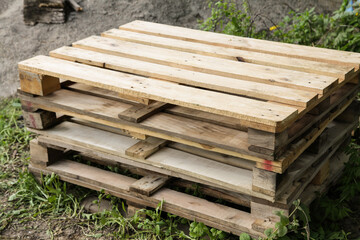 Wooden shipping pallets on outdoor. Piles of euro type cargo pallets.