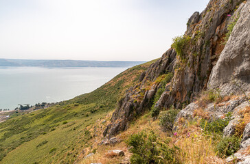 Fototapeta na wymiar View from Mount Arbel to the adjacent valley on the coast of Lake Kinneret - the Sea of Galilee, near the city of Tiberias, in northern Israel