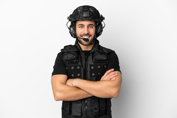 Young caucasian swat isolated on white background keeping the arms crossed in frontal position