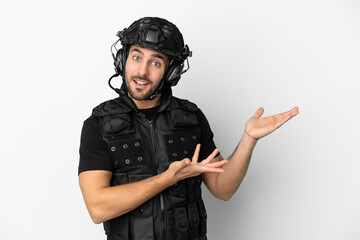 Young caucasian swat isolated on white background extending hands to the side for inviting to come