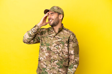 Military man isolated on yellow background has realized something and intending the solution