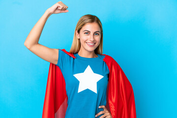 Blonde woman over isolated background in superhero costume and doing strong gesture