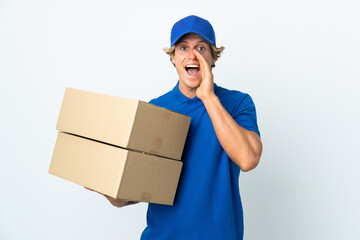 Delivery man over isolated white background shouting with mouth wide open
