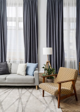 Old Fashioned Armchair And Couch In Living Room With Vintage Decor