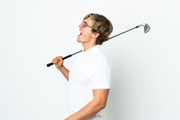 English man playing golf laughing in lateral position