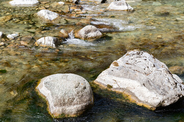 Naklejka na ściany i meble Rocks in the rhine river in Grison in Switzerland