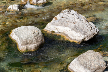 Rocks in the rhine river in Grison in Switzerland
