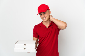 Pizza delivery man with work uniform picking up pizza boxes isolated on white background laughing