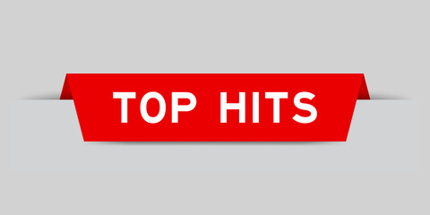 Red color inserted label with word top hits on gray background © bankrx