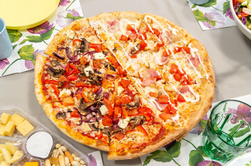 two halves of different pizzas on a platter