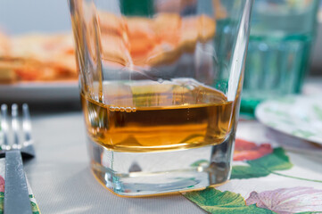 a glass of whiskey on the table