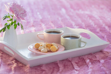 two cups of coffee on white tray in bedroom