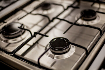 Gas stove for 4 burners, top view. White gas stove, top view, four burners. Soft focus