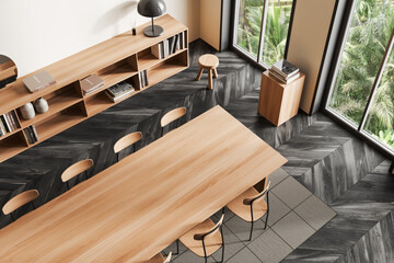 Top view of meeting room interior with chairs and table, drawer and window