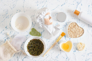 ingredients for home cosmetics, natural cosmetics concept, rice water, tea infusion, raw egg and oatmeal