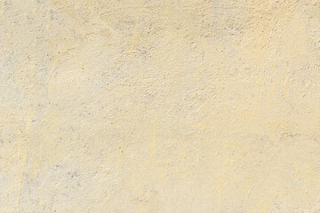 stone wall with yellow paint. textured surface